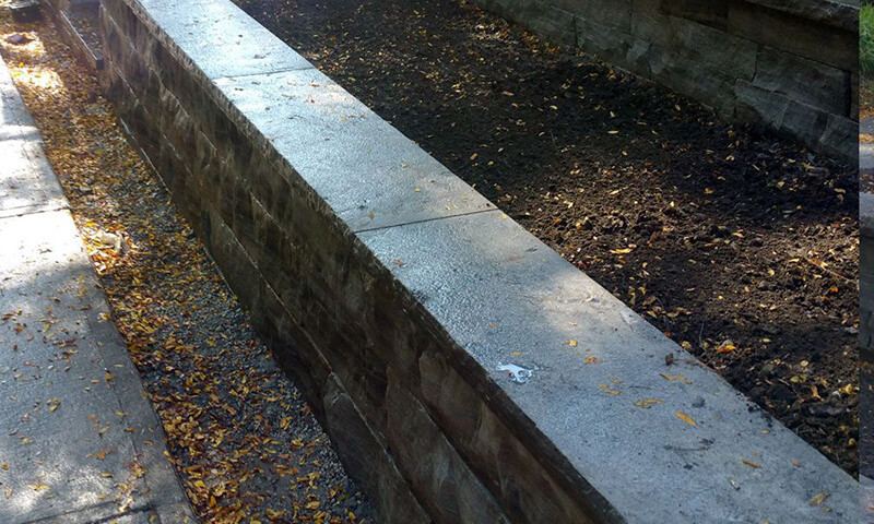Close view of the Eramosa coping along the top of the dry-stacked wall